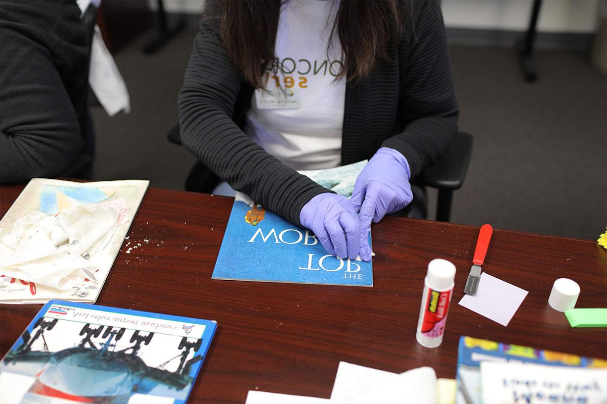 Student repairing a book