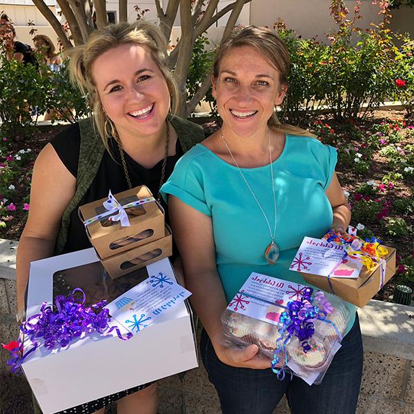 Women holding homemade goodies