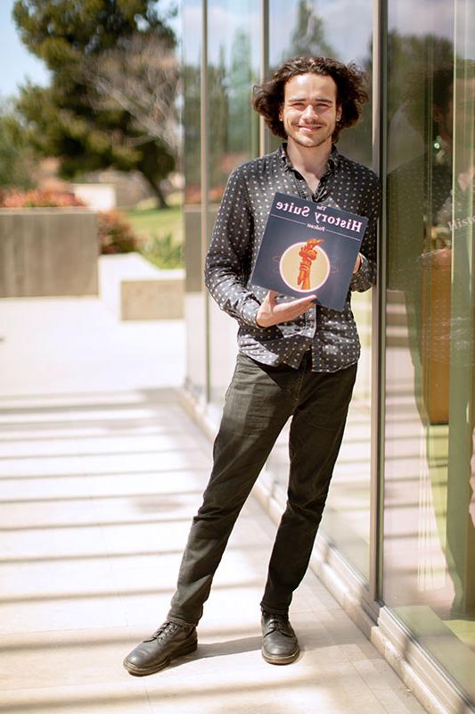 Augustine Mallinson holding one of his projects