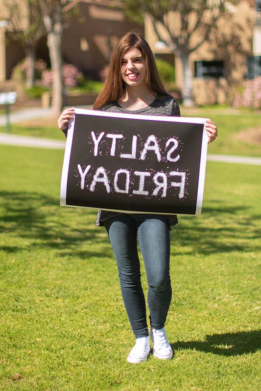 Emily McCarthy holding one of her projects