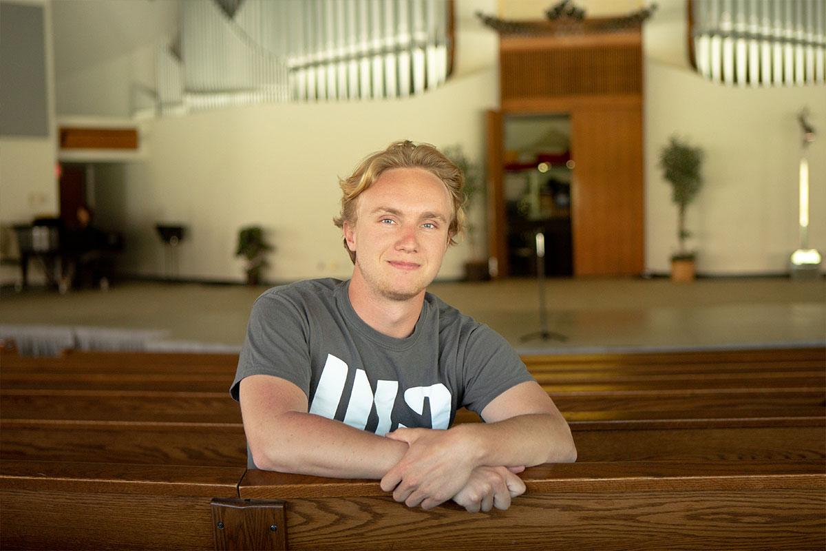 Nathan MacGregor sitting in the CU Center