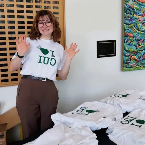 Student passing out I Heart CUI shirts