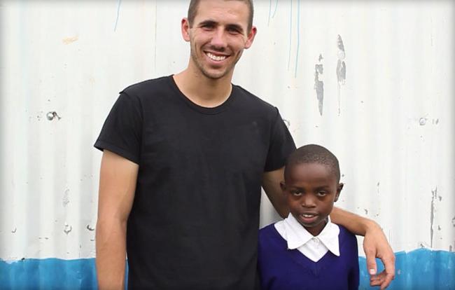 Sam Bretzmen and a young boy from Kenya